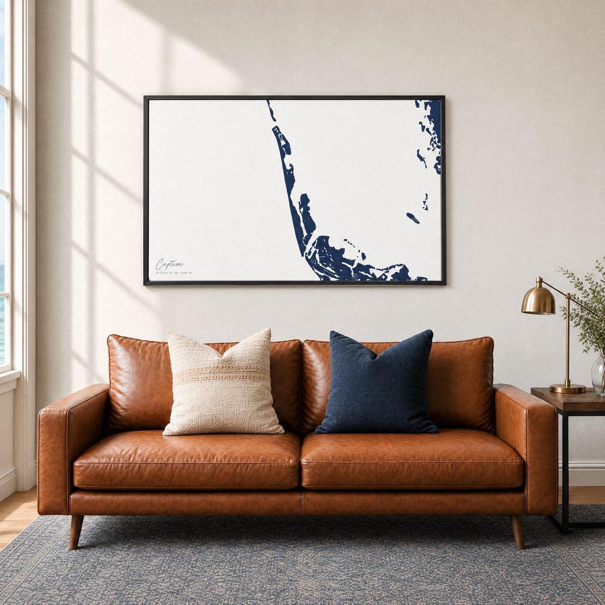 Captiva horizontal canvas map in Navy, black-framed canvas above a sofa