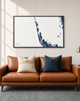 Captiva horizontal canvas map in Navy, black-framed canvas above a sofa