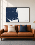 Dewey Beach horizontal canvas map in Navy, black-framed canvas above a sofa
