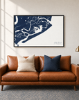 Folly Beach horizontal canvas map in Navy, black-framed canvas above a sofa