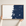 Hernando Beach horizontal canvas map in Navy, hands holding an oak-framed canvas