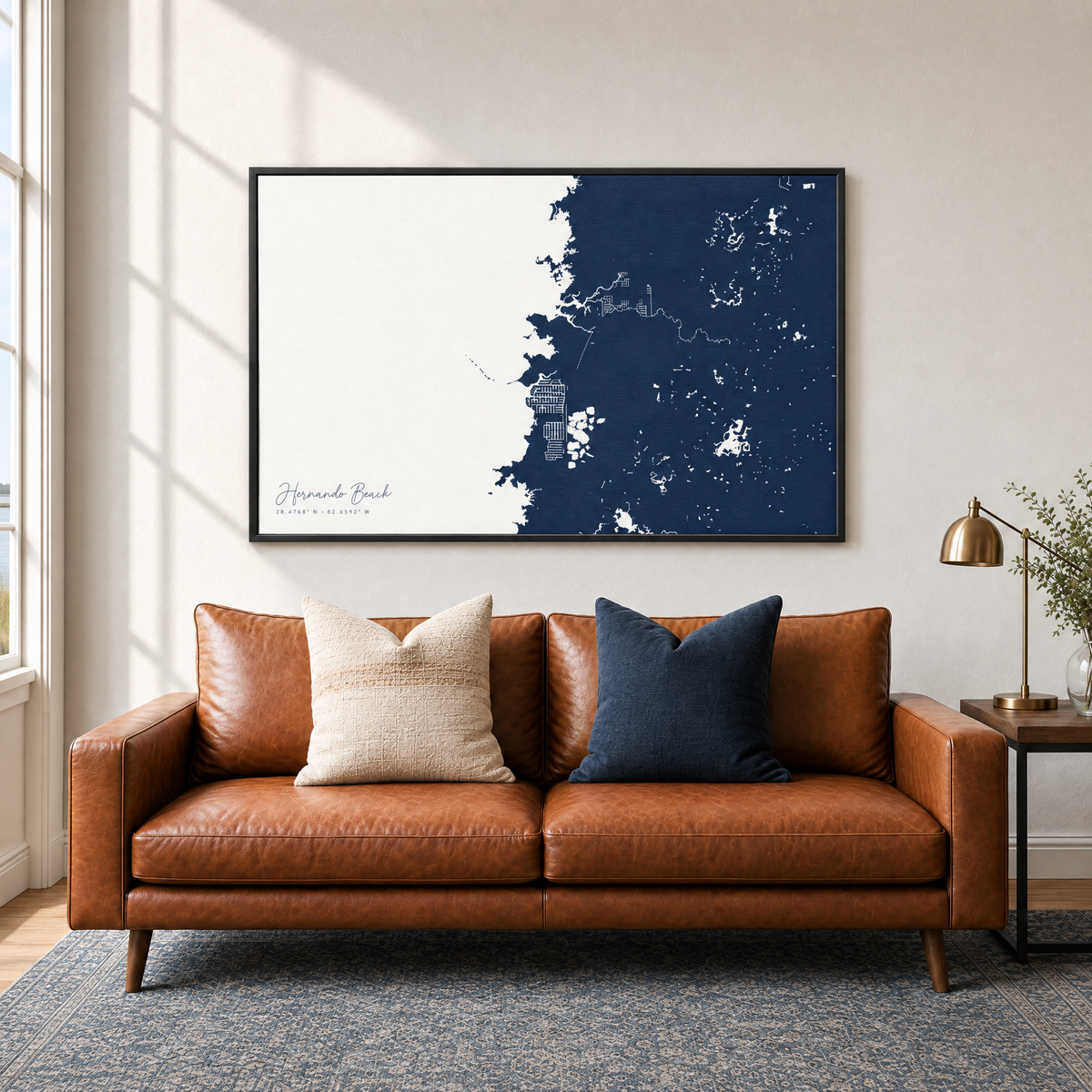 Hernando Beach horizontal canvas map in Navy, black-framed canvas above a sofa