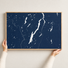 Lake George horizontal canvas map in Navy, hands holding an oak-framed canvas