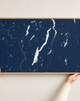 Lake George horizontal canvas map in Navy, hands holding an oak-framed canvas