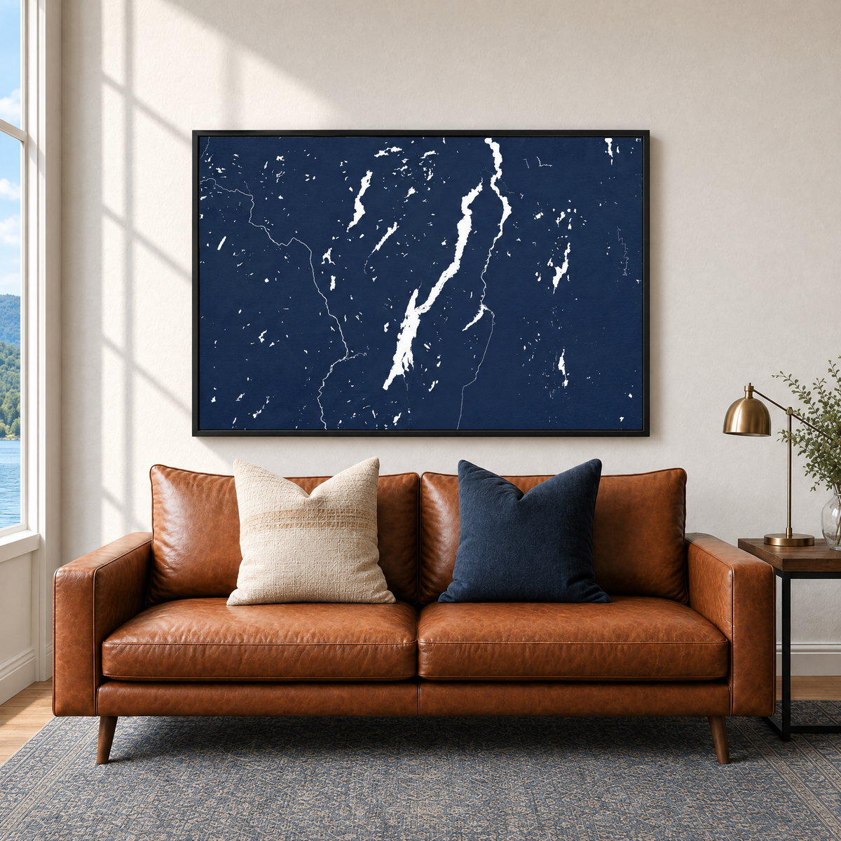 Lake George horizontal canvas map in Navy, black-framed canvas above a sofa