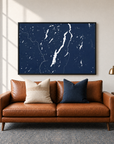 Lake George horizontal canvas map in Navy, black-framed canvas above a sofa