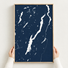 Lake George vertical canvas map in Navy, hands holding an oak-framed canvas