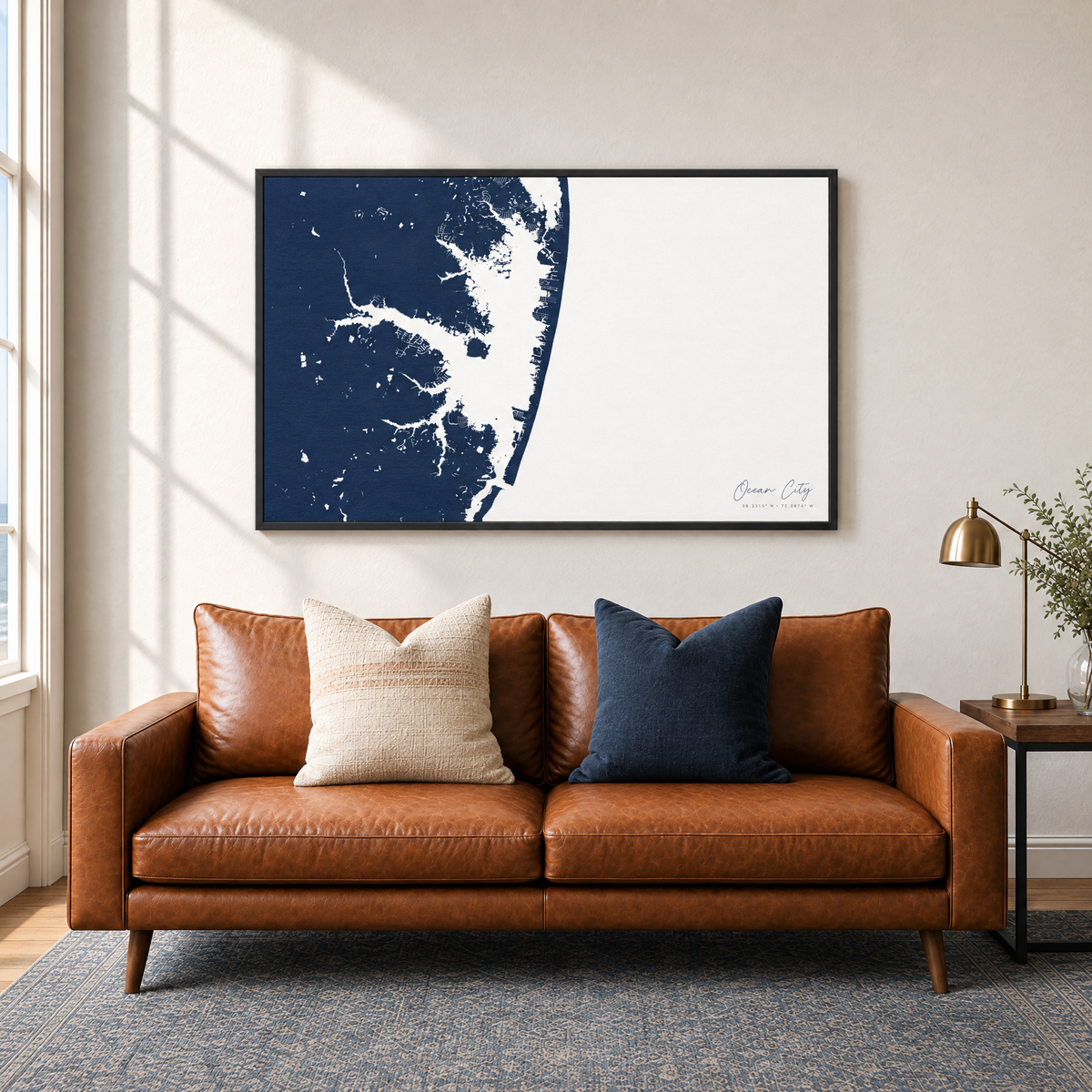 Ocean City horizontal canvas map in Navy, black-framed canvas above a sofa