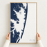 Ocean City vertical canvas map in Navy, hands holding an oak-framed canvas