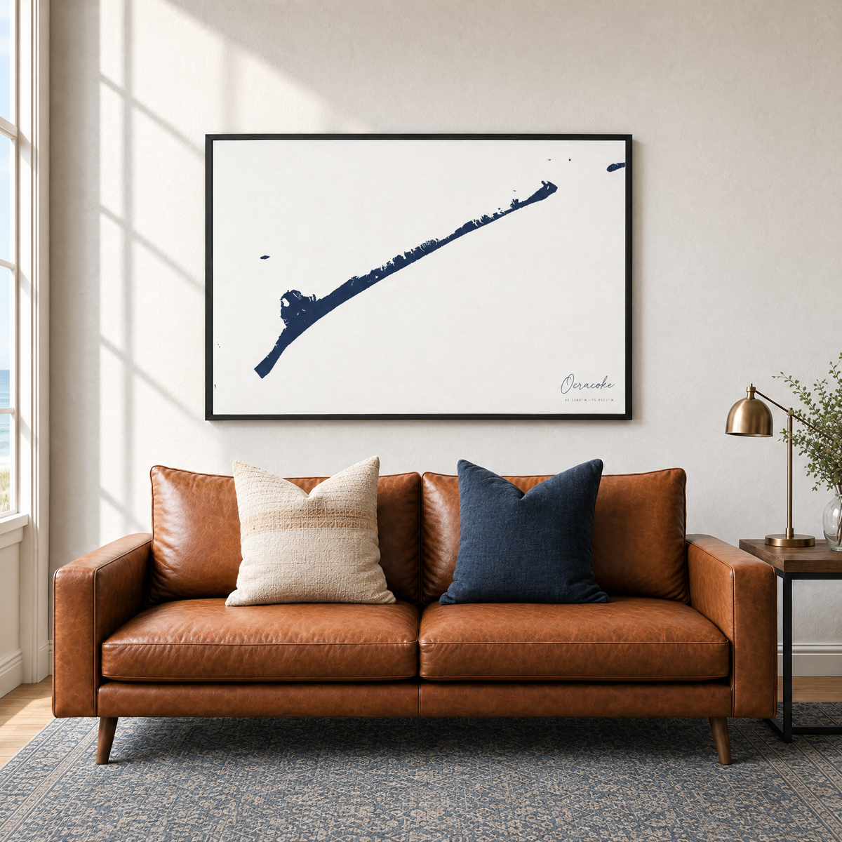 Ocracoke horizontal canvas map in Navy, black-framed canvas above a sofa