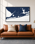 Orange Beach horizontal canvas map in Navy, black-framed canvas above a sofa