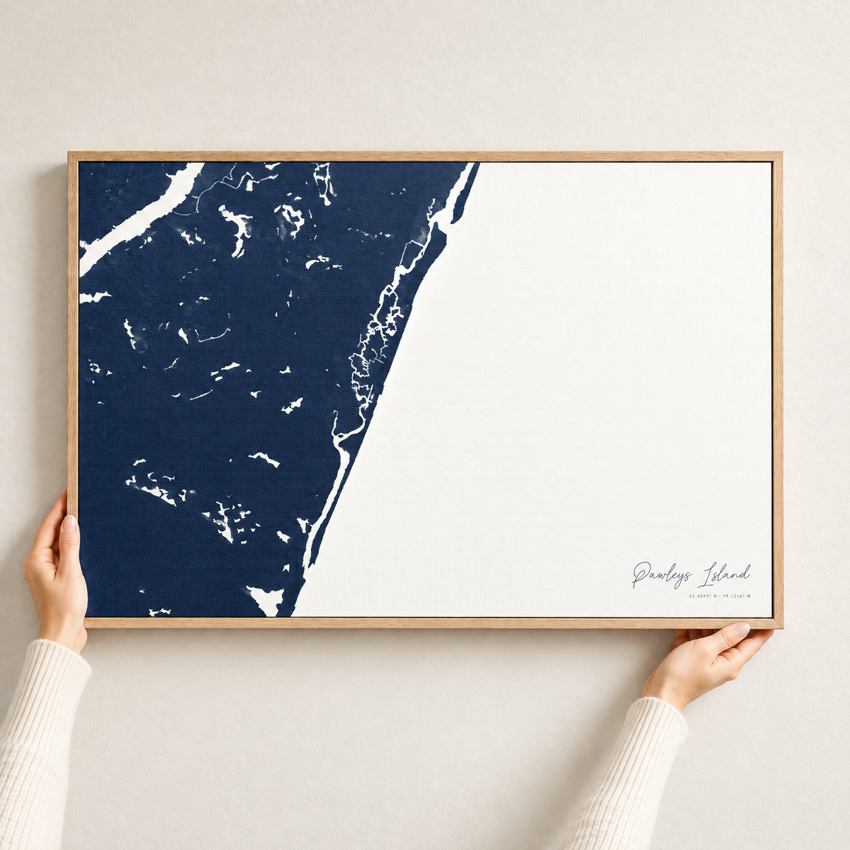 Pawleys Island horizontal canvas map in Navy, hands holding an oak-framed canvas