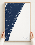 Pawleys Island vertical canvas map in Navy, hands holding an oak-framed canvas