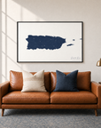 Puerto Rico horizontal canvas map in Navy, black-framed canvas above a sofa