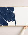 Rehoboth Beach horizontal canvas map in Navy, hands holding an oak-framed canvas