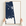 Rehoboth Beach vertical canvas map in Navy, hands holding an oak-framed canvas