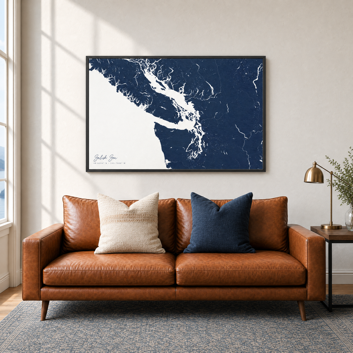 Salish Sea horizontal canvas map in Navy, black-framed canvas above a sofa