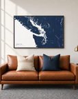 Salish Sea horizontal canvas map in Navy, black-framed canvas above a sofa