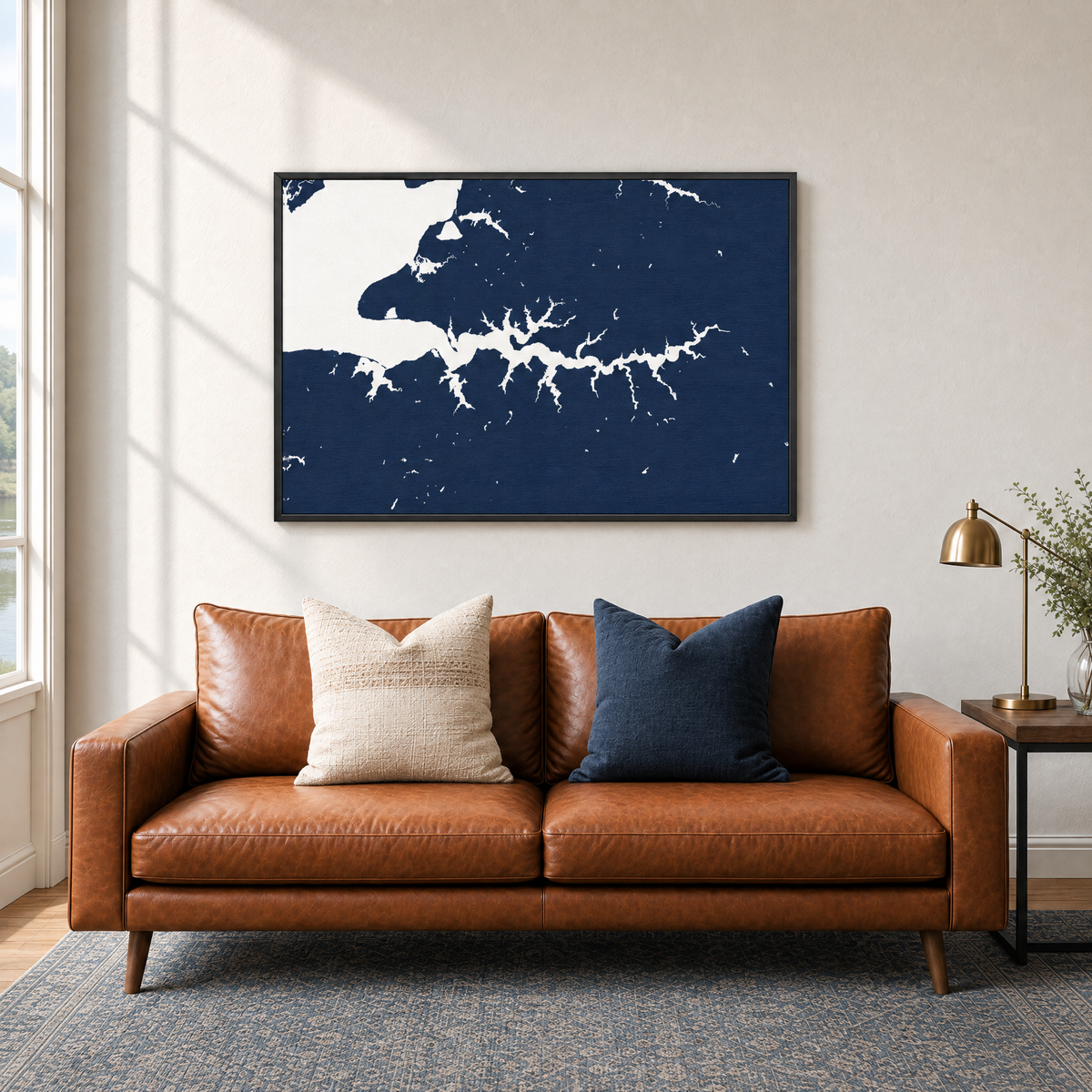 Sassafras River horizontal canvas map in Navy, black-framed canvas above a sofa