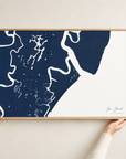 Sea Island horizontal canvas map in Navy, hands holding an oak-framed canvas
