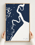 Sea Island vertical canvas map in Navy, hands holding an oak-framed canvas
