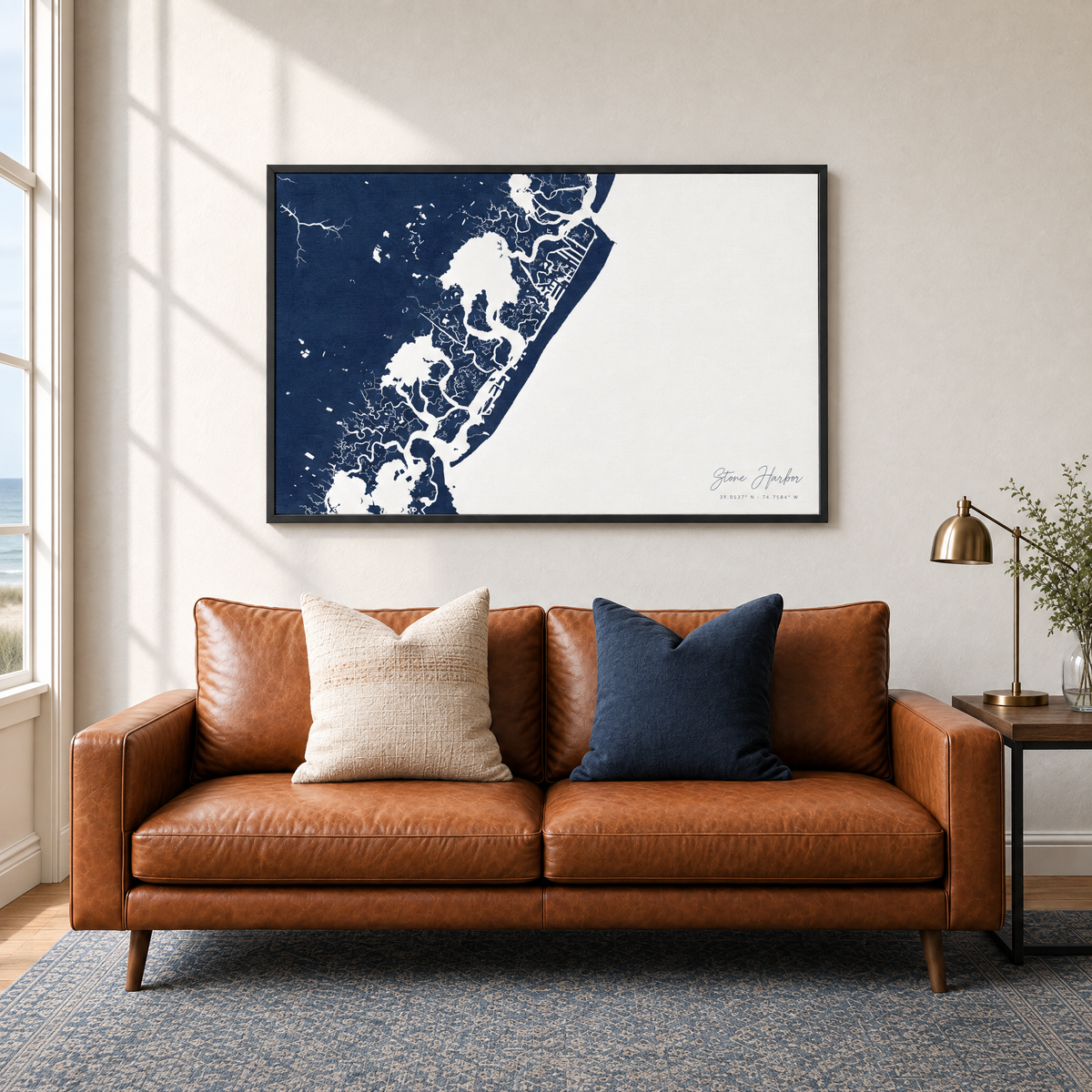 Stone Harbor horizontal canvas map in Navy, black-framed canvas above a sofa