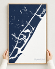 Wrightsville Beach vertical canvas map in Navy, hands holding an oak-framed canvas