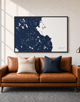 Plymouth canvas map — two-pillow black-frame sofa interior