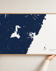 Portsmouth canvas map — hands holding the canvas in an oak frame