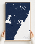 Portsmouth canvas map — hands holding the canvas in an oak frame