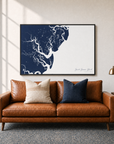 Saint Simons Island canvas map — two-pillow black-frame sofa interior