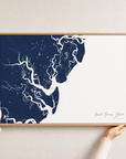 Saint Simons Island canvas map — hands holding the canvas in an oak frame