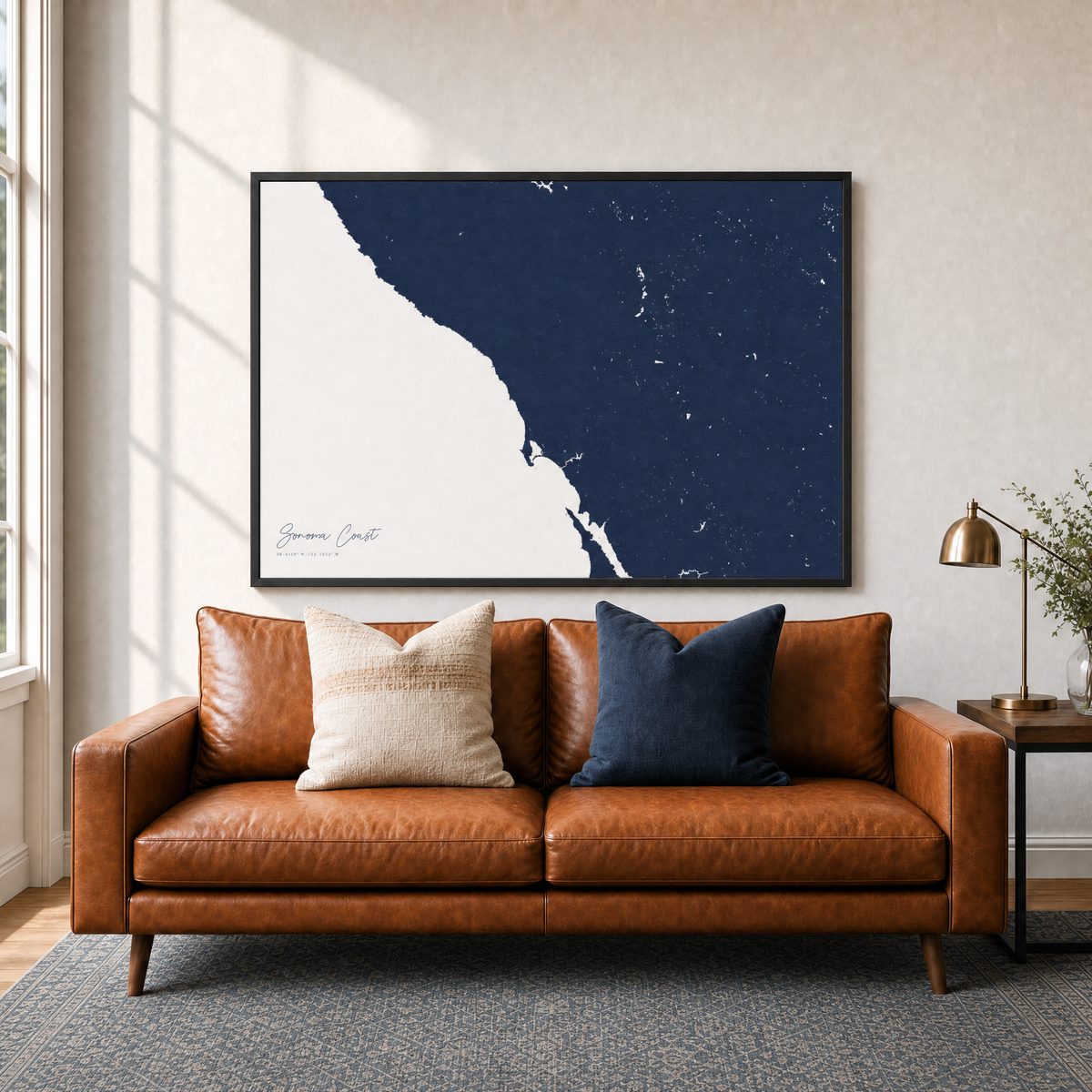 Sonoma Coast canvas map — two-pillow black-frame sofa interior