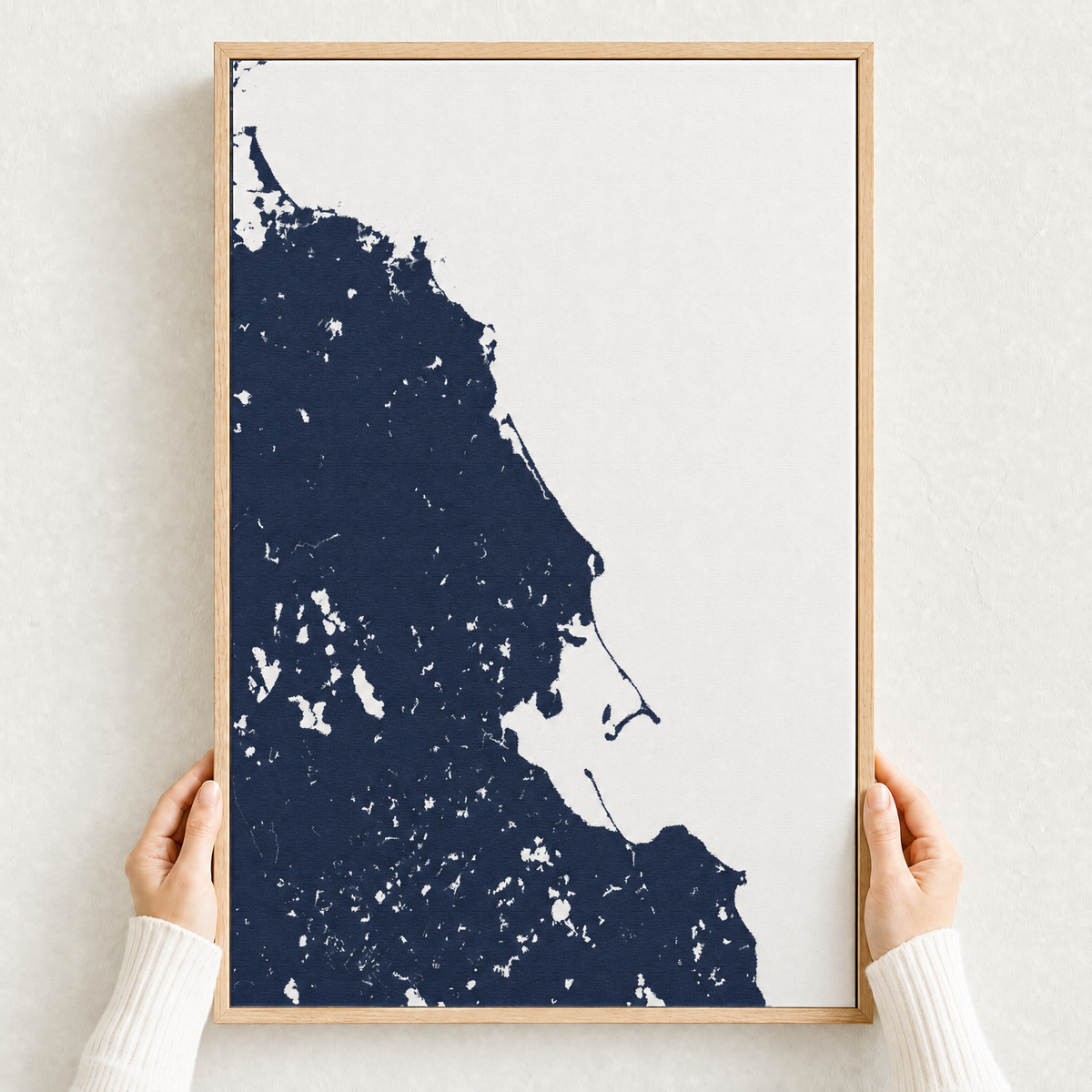 South Shore Massachusetts canvas map — hands holding the canvas in an oak frame