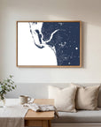 Southwest Florida navy horizontal canvas map in an oak framed room scene