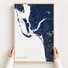 Southwest Florida canvas map — hands holding the canvas in an oak frame