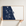 Space Coast canvas map — hands holding the canvas in an oak frame