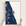 Space Coast canvas map — hands holding the canvas in an oak frame