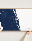 St. Augustine canvas map — hands holding the canvas in an oak frame