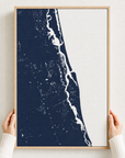 St. Augustine canvas map — hands holding the canvas in an oak frame