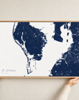St. Petersburg canvas map — hands holding the canvas in an oak frame