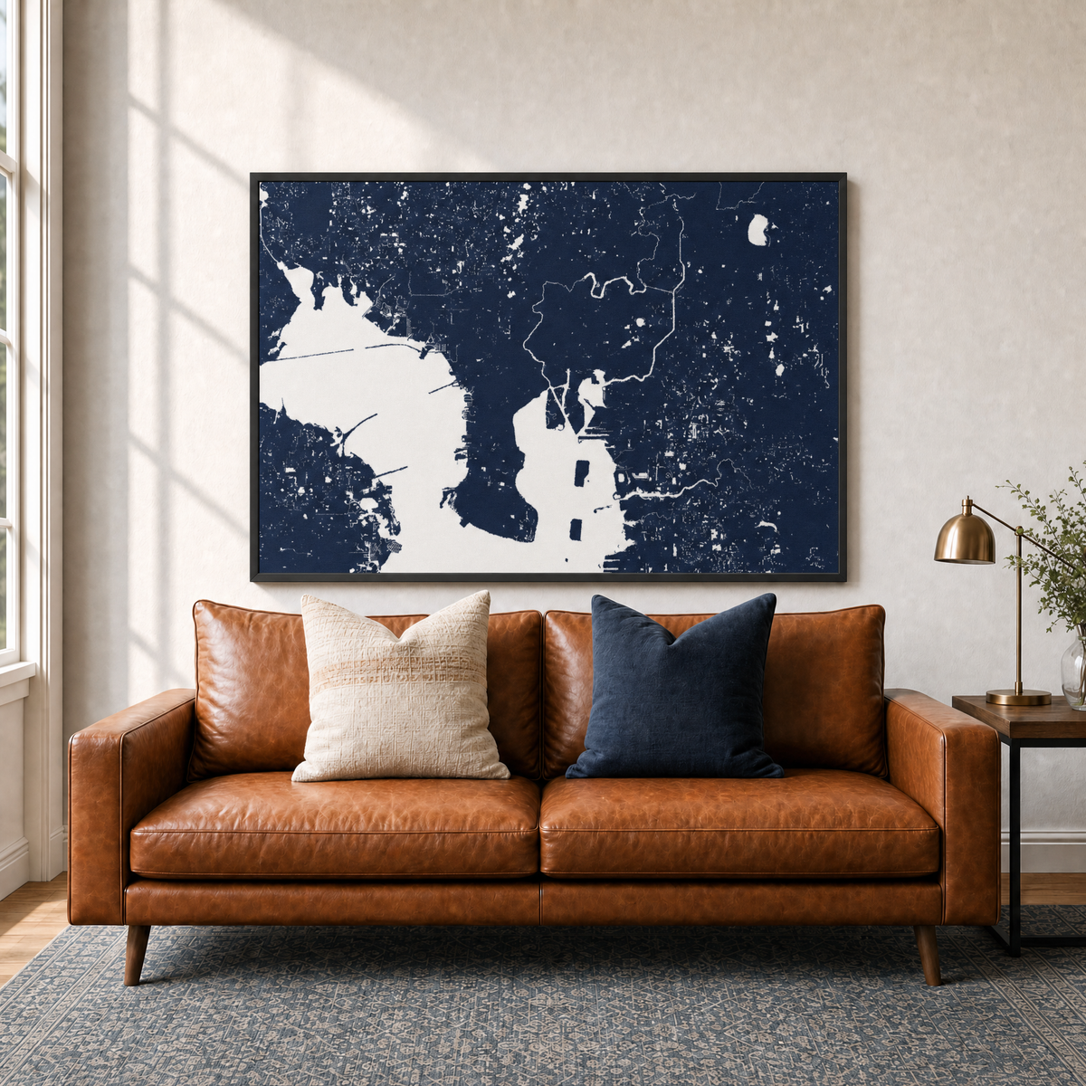 Tampa canvas map — two-pillow black-frame sofa interior