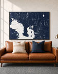 Tampa canvas map — two-pillow black-frame sofa interior