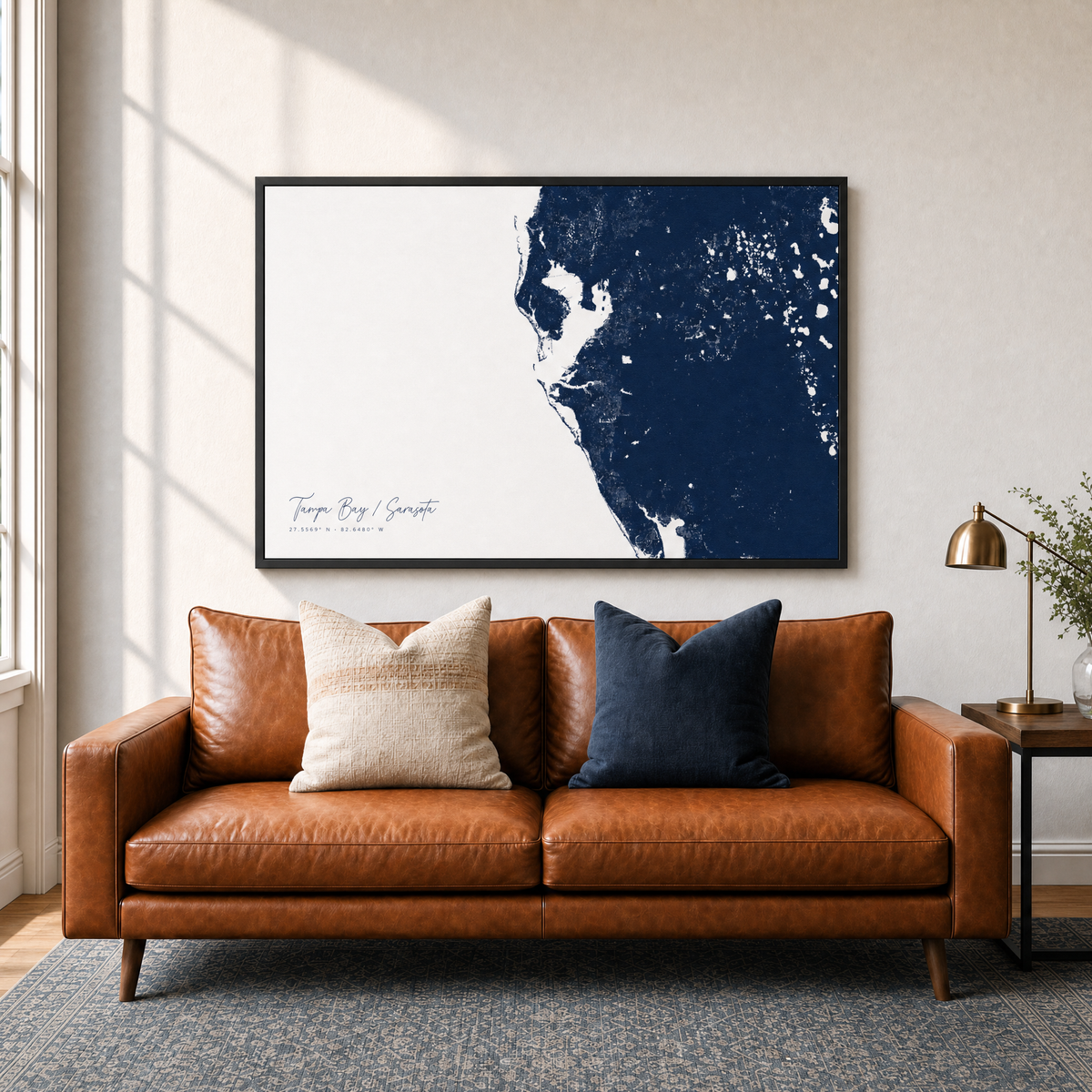 Tampa Bay / Sarasota canvas map — two-pillow black-frame sofa interior