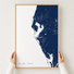 Tampa Bay / Sarasota canvas map — hands holding the canvas in an oak frame