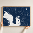 Tampa canvas map — hands holding the canvas in an oak frame