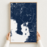 Tampa canvas map — hands holding the canvas in an oak frame