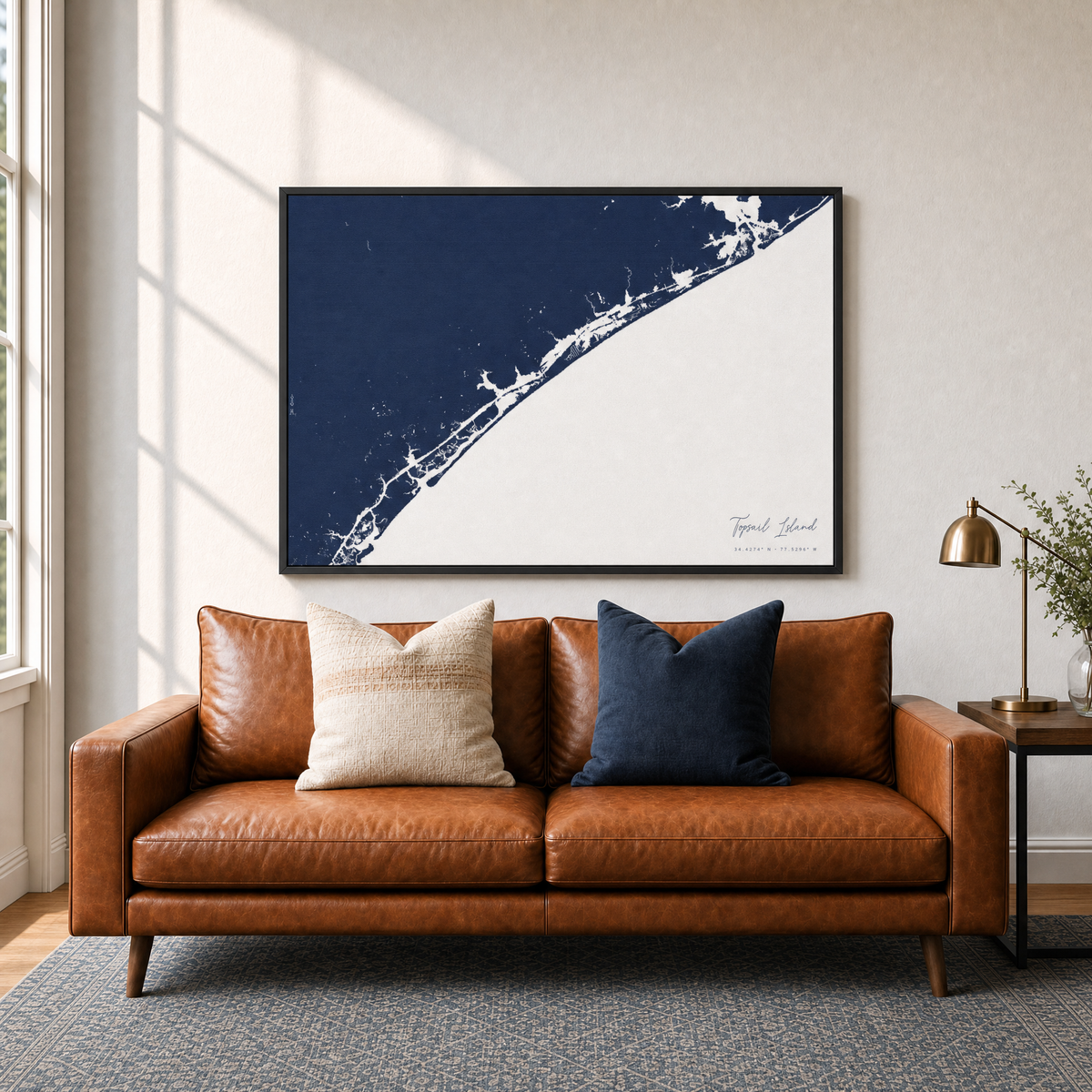 Topsail Island canvas map — two-pillow black-frame sofa interior