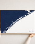 Topsail Island canvas map — hands holding the canvas in an oak frame