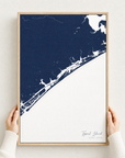 Topsail Island canvas map — hands holding the canvas in an oak frame